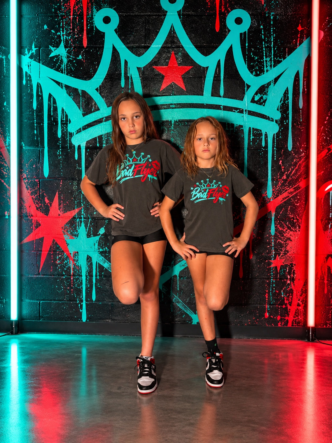 BadFlyer Crowned Different charcoal graphic tee in teal and red